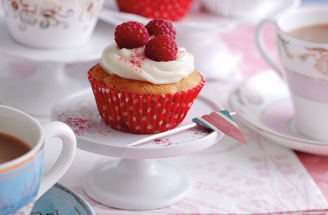 These delightful cupcakes are perfect for a summer street party or celebration. Made with raspberries and then topped with raspberries and a cream frosting, they are sure to impress. Add a touch of sparkle with some edible glitter.