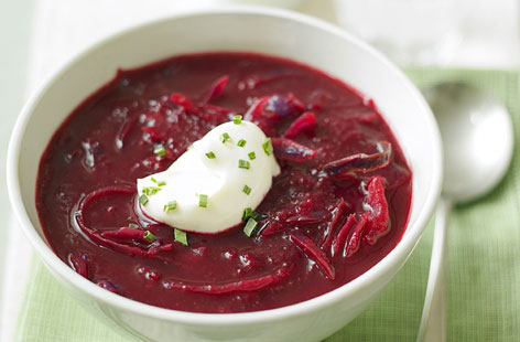 This warming, rich and brightly-coloured soup is inspired by Ukrainian borscht. Simmered beetroot and potato are blended together, then combined with sweet, softened onion and red cabbage. Crème fraîche and chives are added just before serving for a pop of contrast.