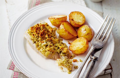 This lovely fish dish is delicious, easy and healthy, too. Breadcrumbs, which are mixed with pesto and lemon, are used to coat the fish. Add new potatoes and peas and you have a guilt-free fish and chips dinner that the whole family will love.