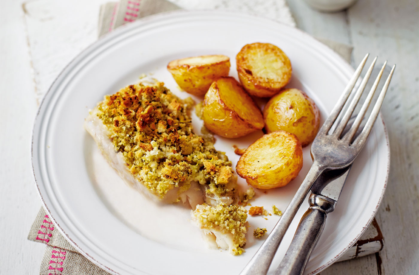Lemon and pesto-crusted fish with potato wedges recipe