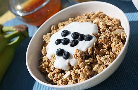 Whipping up a batch of your own granola is easy. Here oats, and gorgeous almonds, sesame and pumpkin seeds are combined with sugar, cinnamon, honey and oil then toasted in the oven until golden and in gorgeous lumps.