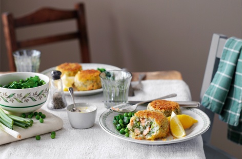 Make your salmon fillets go further with these delicious homemade fishcakes: poached salmon, flaked into pieces then mixed with mashed potato and fresh herbs. Fry the fishcakes first to give them a bit of colour, then finish in the oven.