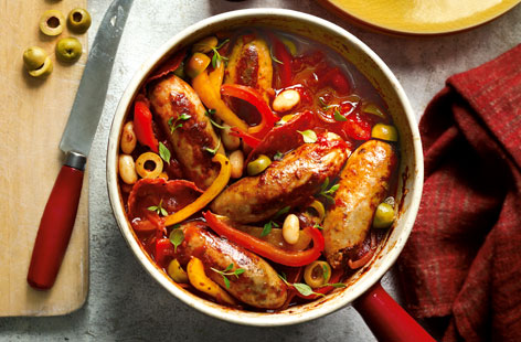 Half fat pork sausages and host of other tasty ingredients combine in this easy stew that's full of flavour. The saline hit of Milano salami slices and green olives is frankly addictive while cannelini beans soak up the sauce like a sponge.