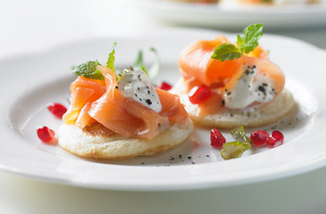 A smoked salmon blini with an unexpected citrus twist.
