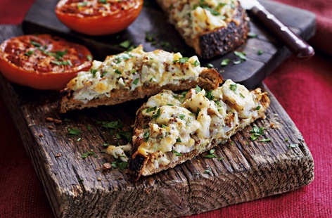 Working as a quick and easy lunch or a light supper, this recipe for smoked haddock rarebit with grilled tomatoes is a British classic. The combination of smoked haddock, strong grainy mustard and mature cheddar cheese isn't exactly subtle. But it is delicious.