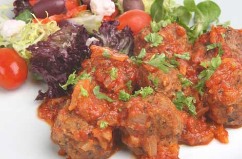 Why don't you try Bottle Green Sweet Lime Cordial with water as an accompaniment to this classic Greek dish