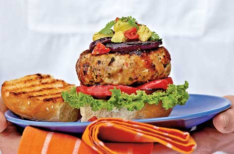 A satisfying but light alternative to classic barbecue grub, this turkey burger recipe layers a chilli-spiced patty with crisp lettuce, sweet pepers and homemade guacamole, sandwiched in a soft burger bun