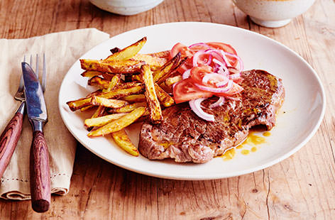 A meat-lover's dream, these mouthwateringly juicy steaks are accompanied by crispy fries and a zesty tomato salsa. This simple recipe guarantees perfectly cooked steak every time, and is sure to be revisited again and again