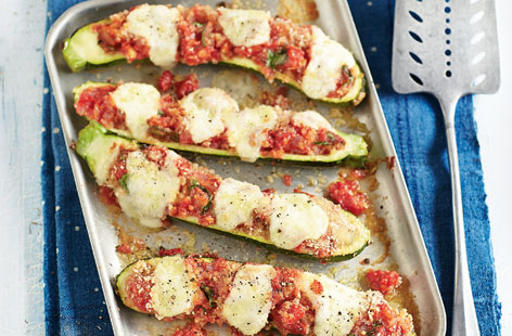 A Mediterranean vegetarian classic, these oozing stuffed courgettes are filled with a spicy onion and tomato sauce, and topped with mozzarella and crunchy breadcrumbs. Delicious with Puy lentils or on their own.