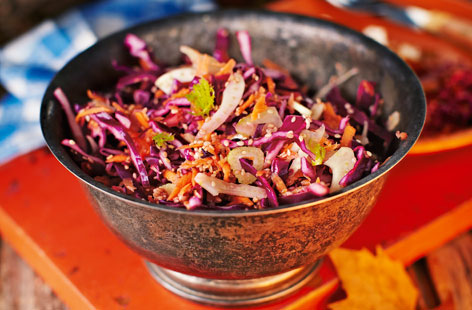 Red cabbage, carrots and fennel form the basis of this crunchy, colourful slaw. The sweet and spicy dressing combines sesame oil, ginger, lime, maple syrup and ground ginger for a moreish Asian twist.