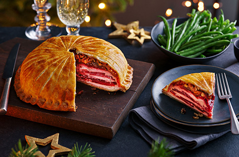 For a festive vegetarian showstopper, try this beetroot and ricotta stacked pithiver recipe. Bright layers of beetroot are layered up with herby ricotta and wrapped in buttery puff pastry - bake until golden and slice to reveal the striking striped effect inside.
