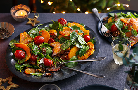 If you're looking for a simple Christmas starter to serve this year, try this colourful roasted squash salad. With roasted tomatoes, fresh spinach and a festive pomegranate dressing, this vegan and gluten-free starter can kick off your Christmas dinner for everyone.