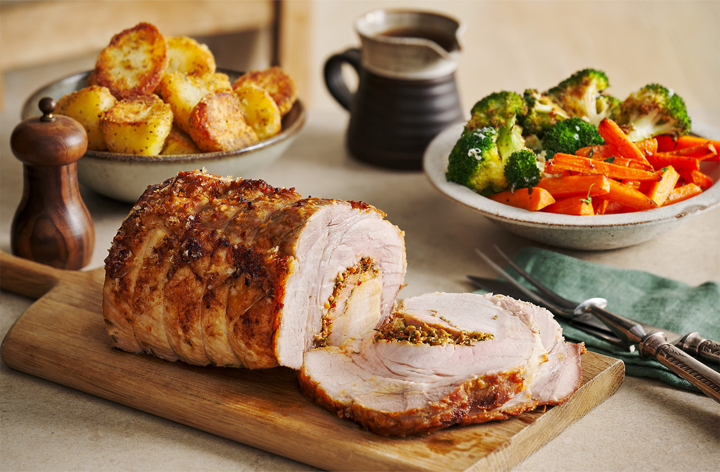 Porchetta-style roast pork with herb-roasted vegetables recipe
