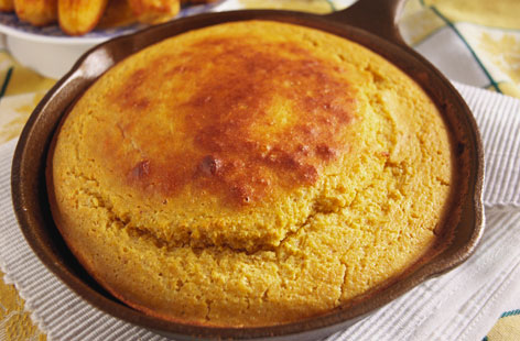 A delicious corn bread with two kinds of cheese to enrich it and onions sautéed in butter to add to the flavour.