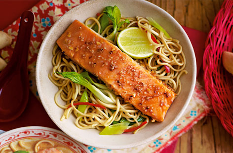 A Japanese inspired supper with individual parcels of noodles, leek and pak choi, and oven-baked Teriyaki salmon.