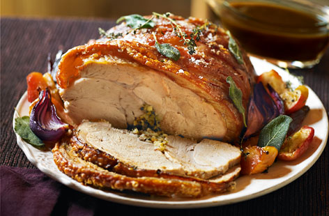 Indulge your mum on Mother's Day with this slow-cooked roast pork with sticky caramelised apples and cider gravy.
