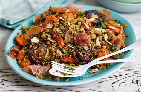 A hearty and filling salad that's perfect for a light lunch or satisfying side, flecked with fluffy red and white quinoa, sweet roasted carrots and salty cured ham