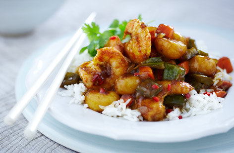 Have a go at a takeaway classic at home with this easy sweet and sour prawns recipe. Stir crispy fried prawns into a simple sweet and sour sauce with peppers, carrots and fresh chilli for a healthy Chinese treat.
