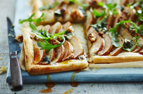 For a delicious starter and spin on the classic pear, walnut and roquefort salad, try this impressive-looking tart at your next dinner party. The three, classic ingredients are arranged on puff pastry then baked in the oven until the pastry is golden and crisp.