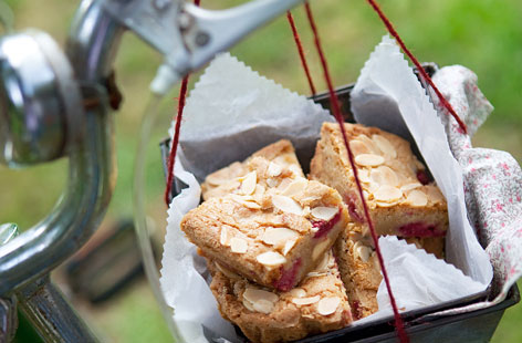 Make a batch of these delicious blondies using creamy white chocolate, fresh raspberries and flaked almonds