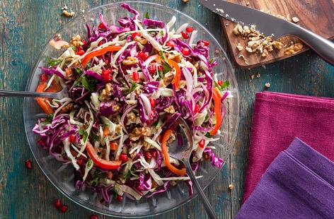 This super-healthy winter salad is bursting with flavour and goodness. There's Vitamin C from the red and white cabbage, red onion and red pepper, while the pomegranate seeds add bite (and a touch of sparkle!). Walnuts add an earthy crunch.