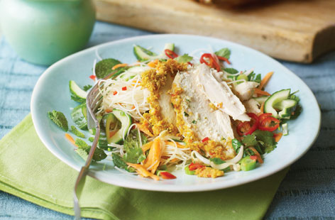 This luxurious noodle salad gets the most from a whole roast chicken smothered in a spicy homemade Thai paste. Prepare the salad and dressing while the chicken is resting, then carve and serve, spooning over the delicious juices from the roasting tin.