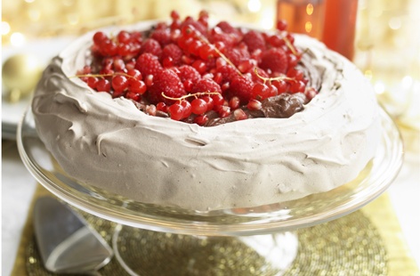 A wonderful indulgent celebratory dessert, this chocolate, raspberry and pomegranate pavlova is perfect for entertaining guests and it can even be prepared in advance and assembled just before serving