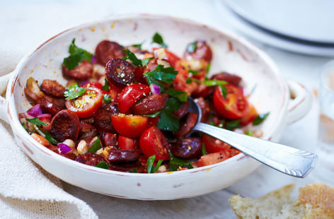 This is a great side salad, starter or light lunch option. The gentle heat of the chorizo, the tang of the tomatoes and the sweetness of the red onions each provide the perfect complement to each other. Serve with crusty bread.
