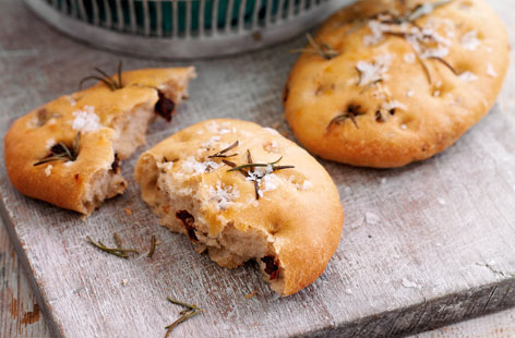 Even the most novice of bakers will find themselves hard-pressed to mess up this mini rosemary and sundried tomato focaccia. It's practically foolproof and best eaten when fresh out of the oven and drizzled in high-quality olive oil.
