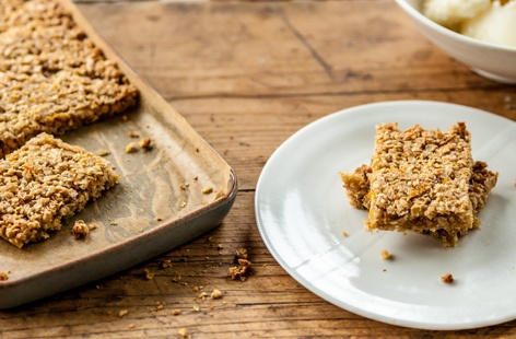 Whip up some homemade frozen yogurt to serve alongside these sweet, oat-packed honey flapjacks for a delicious after-dinner treat.