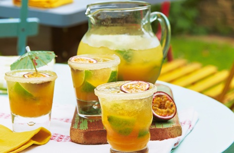 Bring Club tropicana into your living room with these fruity Brazilian-inspired caipivodkas. You'll need plenty of juicy passionfruit and limes to make enough for everyone. And for that mixologist touch, rim the glasses with sugar.