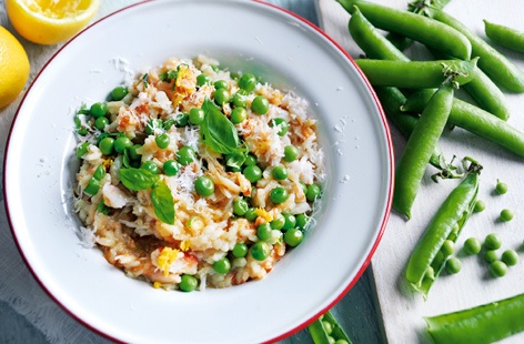 This delicious risotto recipe just oozes with summer goodness. Delicate crab and sweet pea are a natural flavour match with the fragrant basil and the tang of lemon. If you don't have wine or don't drink it, use a little extra stock instead.