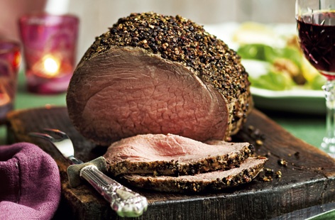 Wow your guests with a topside of beef covered in a peppercorn coating. This recipe couldn't be easier and it really delivers on flavour. Serve with Yorkshire puddings, roast potatoes and all the trimmings.