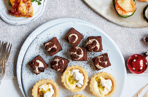 Give your chocolate brownie bites an indulgent twist with this delicious rum and raising topping, made with double cream and icing sugar