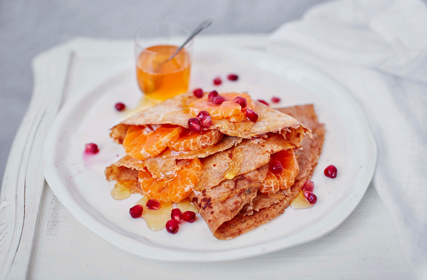 Spelt pancakes with clementine and pomegranate recipe