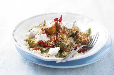 A mediterranean-style vegetarian supper with roasted sweet potato and red and green peppers. While the veg is roasting, stir olive oil and spicy harissa sauce into fluffy couscous. Just before serving, top the dish with crumbly feta for a salty, creamy kick.